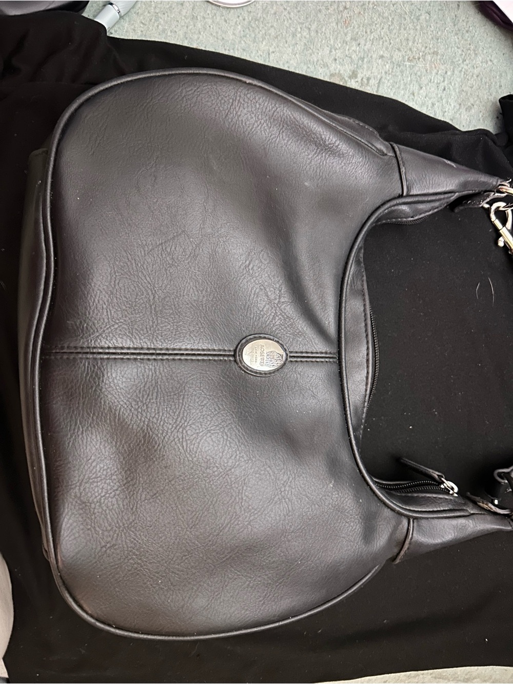 Rosetti Black Leather Curved Shoulder Bag with Oval Metal Logo